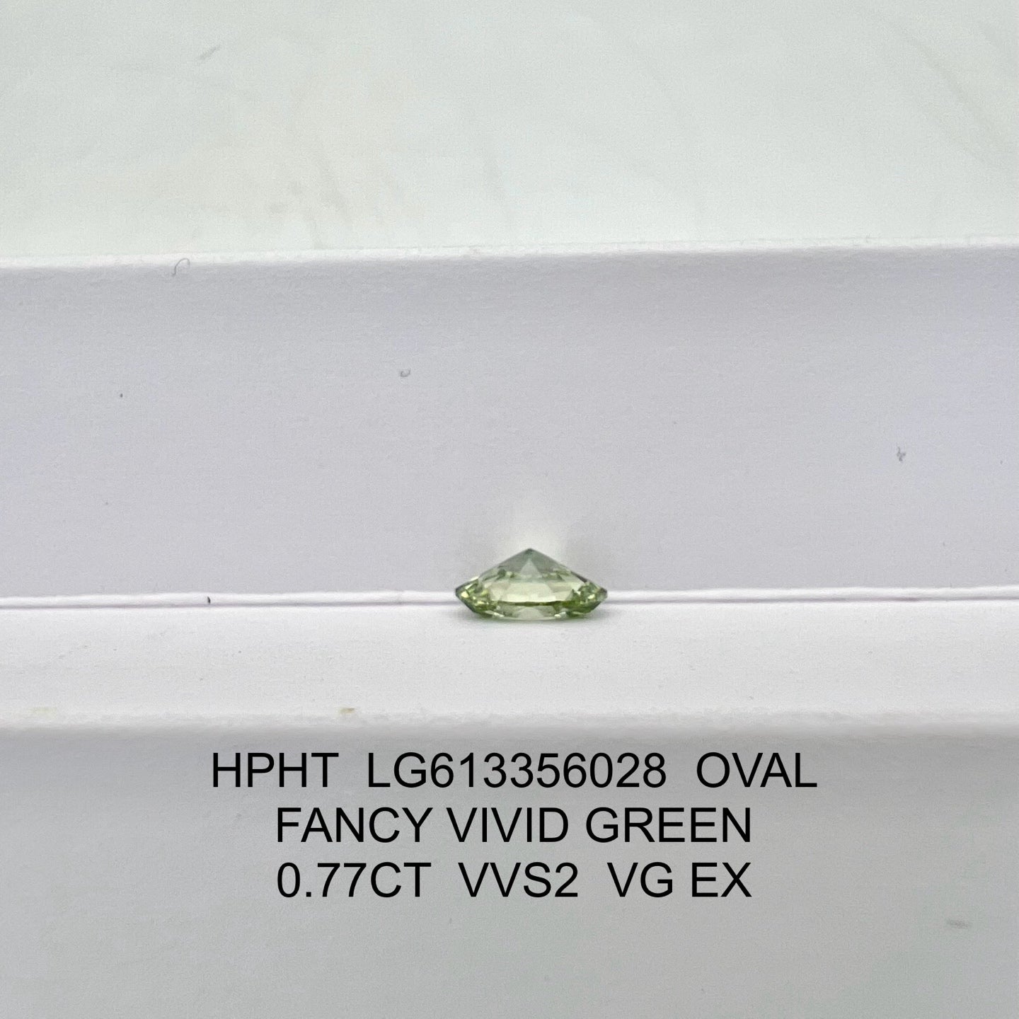 Lab Grown Diamond Fancy Vivid Green Oval 0.77 Carat VG EX HPHT VVS2 IGI Certified