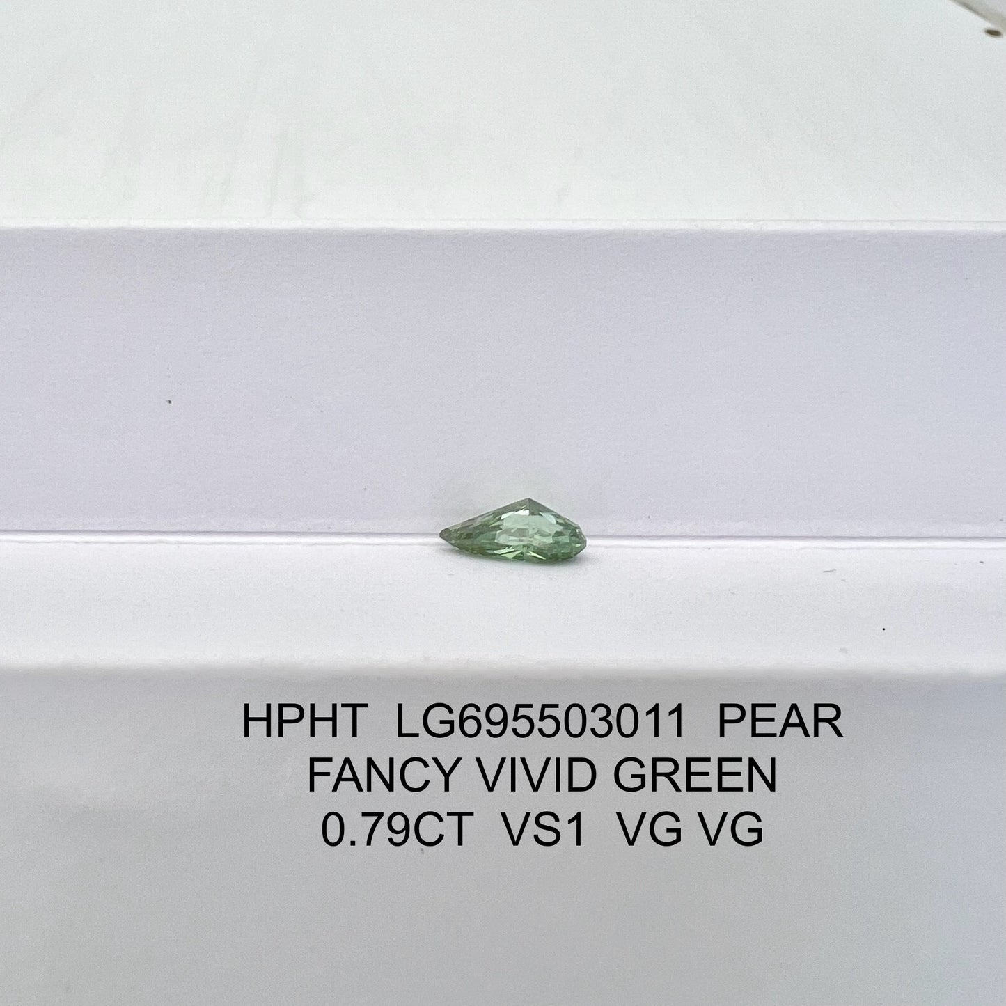 Lab Grown Diamond Fancy Vivid Green Pear 0.79 Carat 2VG HPHT VS1 IGI Certified